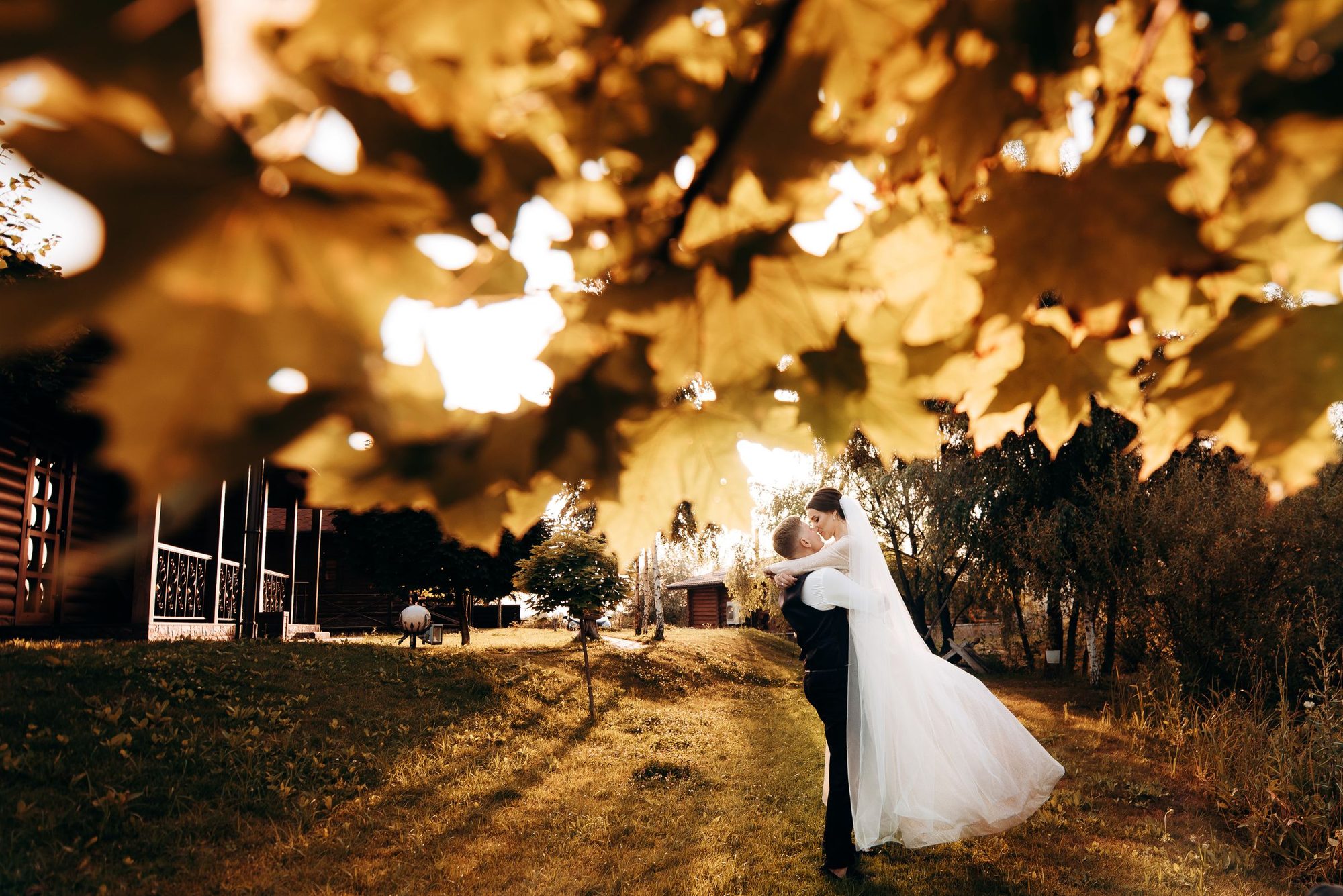 Couple walking under autumn trees