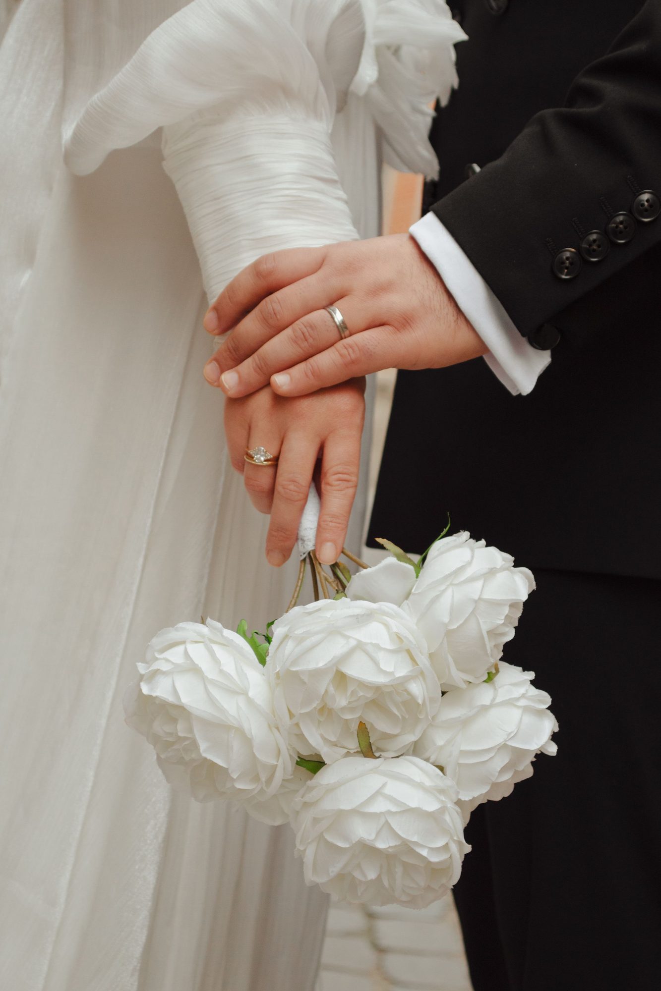 Couple holding white bouquets
