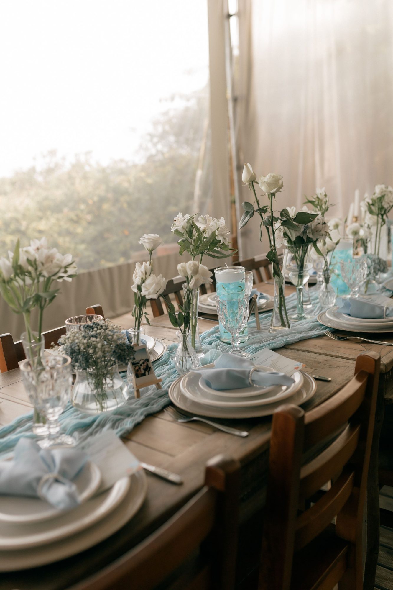 Outdoor table with floral centerpieces
